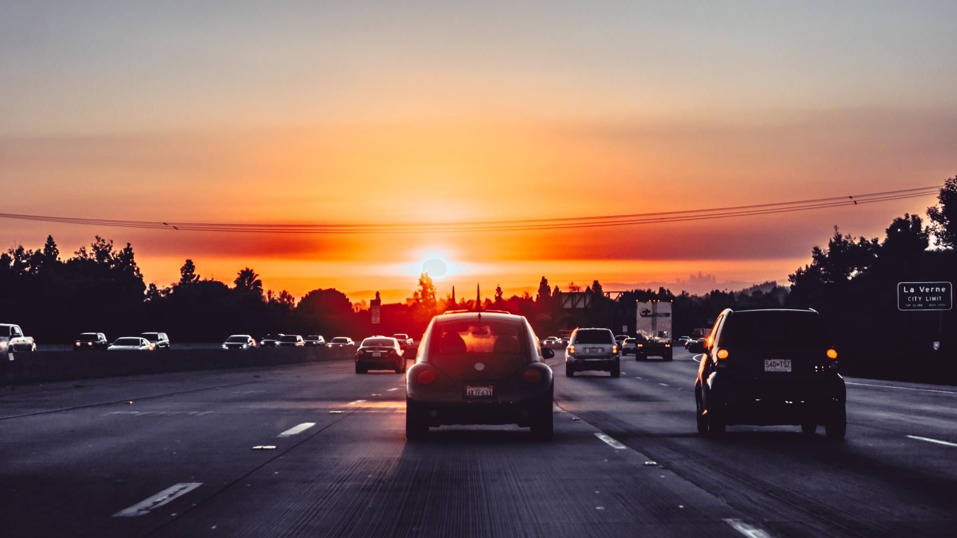 A sunset over a highway